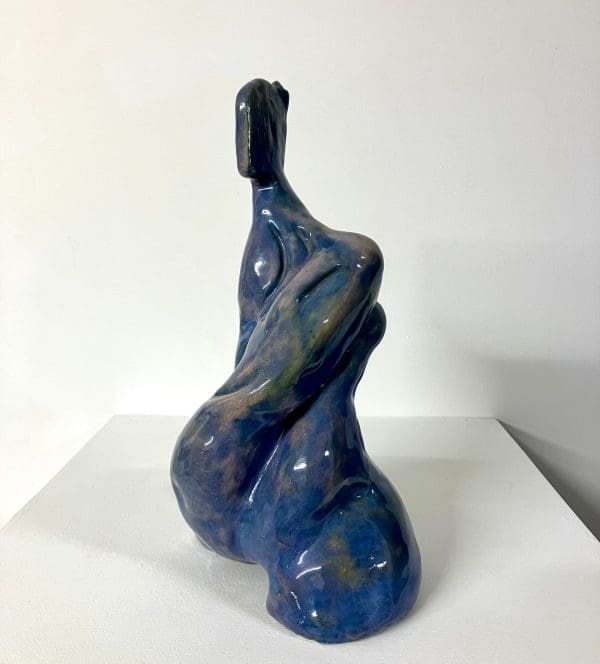 Ceramic figure of contemporary expectant mother